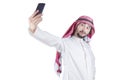 Arabian man taking a selfie portrait