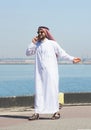 Arabian man talking on the cell phone in the port Royalty Free Stock Photo