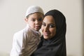 Arabian mother holding her son Royalty Free Stock Photo