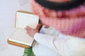 Arabian muslim man reading Quran at home