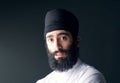 Arabian muslim man wearing black scarf looking at the camera