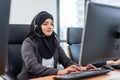 Arabian or Muslim woman works in a call center operator Royalty Free Stock Photo