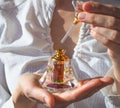 Arabian oud attar perfume or agarwood oil fragrances in crystal bottle. Royalty Free Stock Photo