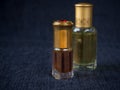 Arabian oud attar perfume or agarwood oil fragrances in mini bottles. Royalty Free Stock Photo