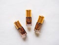 Arabian oud attar perfume or agarwood oil fragrances in mini bottles. Royalty Free Stock Photo