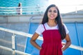 Arabian student woman sitting on stairs outdoors