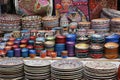 Arabian style colorful ceramic plates and cutlery for sell in a street market stall