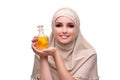 The arabian woman with bottle of perfume isolated on white Royalty Free Stock Photo