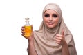 The arabian woman with bottle of perfume isolated on white Royalty Free Stock Photo