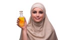 The arabian woman with bottle of perfume isolated on white Royalty Free Stock Photo