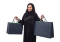 Arabian woman carrying shopping bags isolated on white