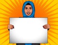 Arabian woman holds a white sheet in her hands. Royalty Free Stock Photo