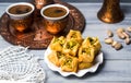 Arabic baklava with coffee in copper cups Royalty Free Stock Photo