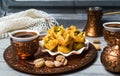 Arabic baklava with coffee in copper cups