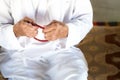 Arabic Bedouin Muslim man in traditional white holiday clothing