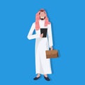 Arabic business man holding tablet suitcase wearing traditional clothes online communication concept arab businessman Royalty Free Stock Photo