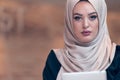 Arabic business woman wearing hijab,working in startup office. Royalty Free Stock Photo