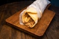 Arabic Chicken shawarma roll wrap served isolated on wooden board top view arabic spicy fastfood