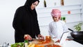 Arabic child in the kitchen with his mother Royalty Free Stock Photo