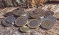 Arabic coins of dirhams and Euro coins on vintage background.