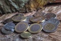 Arabic coins of dirhams and Euro coins on vintage background.
