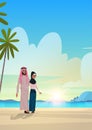 Arabic couple in love arab man woman embracing on tropical island sea beach sunrise seascape summer vacation concept Royalty Free Stock Photo