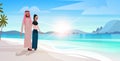 Arabic couple in love man woman embracing on tropical island sea beach sunrise seascape summer vacation concept