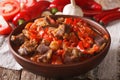 Arabic cuisine: lamb stew with vegetables close up in a bowl. ho