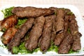 Arabic cuisine traditional food beef Kofta, kebab and tarb kofta which is minced meat wrapped in lamb fat charcoal grilled Royalty Free Stock Photo