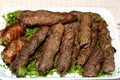 Arabic cuisine traditional food beef Kofta, kebab and tarb kofta which is minced meat wrapped in lamb fat charcoal grilled Royalty Free Stock Photo