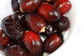 Arabic Dark Red Date Palm Fruits In White Background. Selective Focus Royalty Free Stock Photo