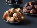 Arabic dates fruits are laid out on a dark table Royalty Free Stock Photo