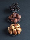 Arabic dates fruits are laid out on a dark table Royalty Free Stock Photo