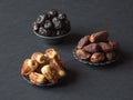 Arabic dates fruits are laid out on a dark table Royalty Free Stock Photo