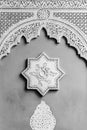 Arabic decoration of a wall with an eight-point star and a bow in the socket. Black and white image