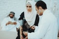 Arabic Doctor Checking Heartbeat a Muslim Woman