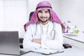 Arabic doctor smiling at workplace Royalty Free Stock Photo