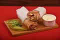 Arabic Fajita chicken wrap sandwich, with Pickles and Mayonnaise Garlic sauce bowl. Traditional Middle Eastern snack.