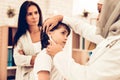 Arabic Female Doctor Examining a Little Boy Royalty Free Stock Photo