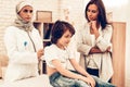 Arabic Female Doctor Examining a Little Boy Royalty Free Stock Photo