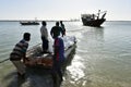 Young Fishermen loading the fishing boat with ice for the fish to stay fresh