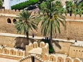 Arabic fortress in the sunshine with palm trees in Tunisia, Sousse