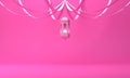 Arabic hanging lantern with ribbon on pink pastel background.