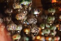 Arabic lamps hang in a Turkish shop. Beautiful handmade Islamic lamps, a tourist souvenir and a symbol of Arab countries Royalty Free Stock Photo