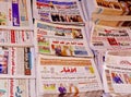 Arabic-language newspapers on sale on newsstand in Cairo street, Egypt