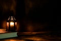 Arabic lantern with candle at night for Islamic holiday. Muslim holy month Ramadan. Royalty Free Stock Photo