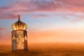 Arabic lantern glow on desert sand