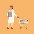 Arabic man carrying shopping cart purchase paper packages concept arab man customer supermarket buying products male