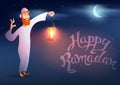 Arabic man keeps illuminated colorful ramadan lantern Royalty Free Stock Photo