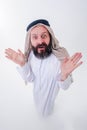 Arabic man in national dress smiles and is surprised. Mouth and eyes wide open. Emotions colorful people Royalty Free Stock Photo